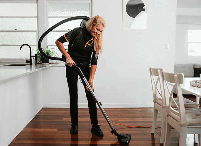 img_services_ndiscleaning Vacuuming hardwood floors