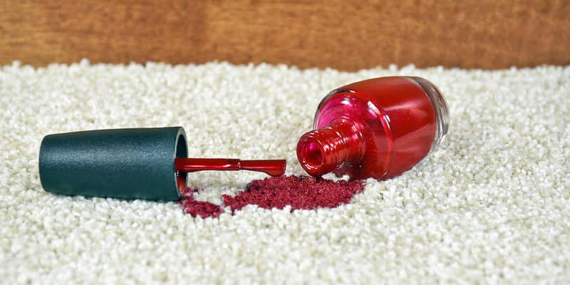 red nail polish spill on light colored carpet