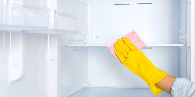 cleaning refrigerator with a sponge