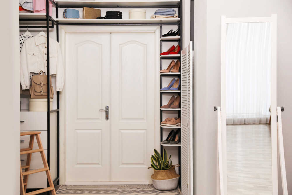 Closet interior with storage rack for shoes, clothes and accessories