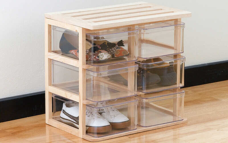 A modern design of shoe boxes on a wooden stand for storage the shoes