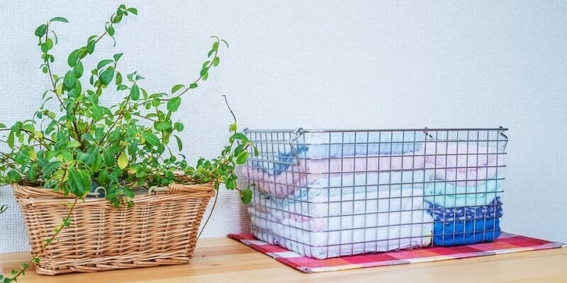 towels in a wire mesh basket