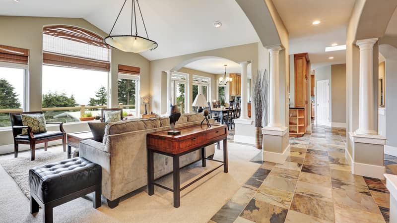 Studio interior in luxurious house with arches and natural stone tile floor