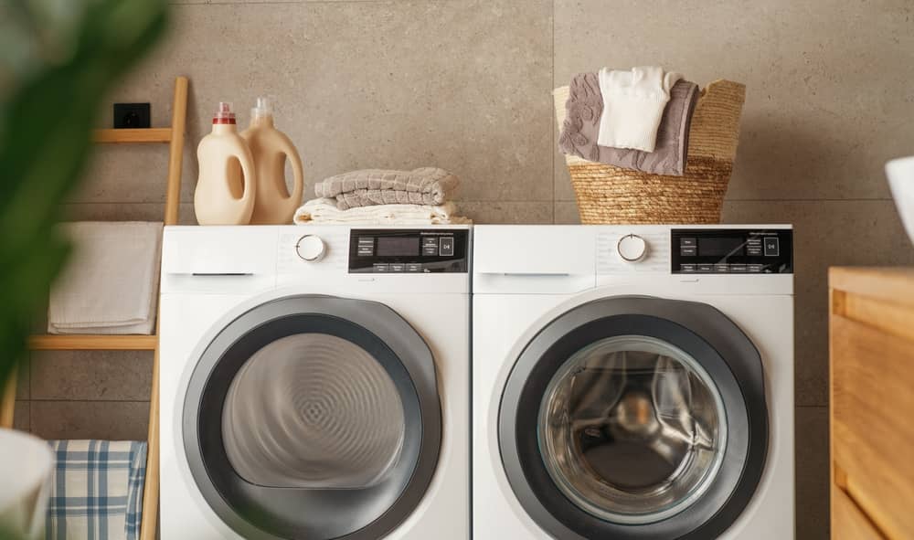 Interior of a laundry room with washing machine and dryer at home