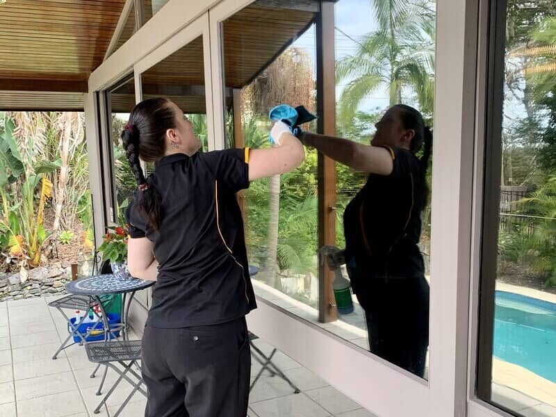 professional cleaner cleaning exterior windows