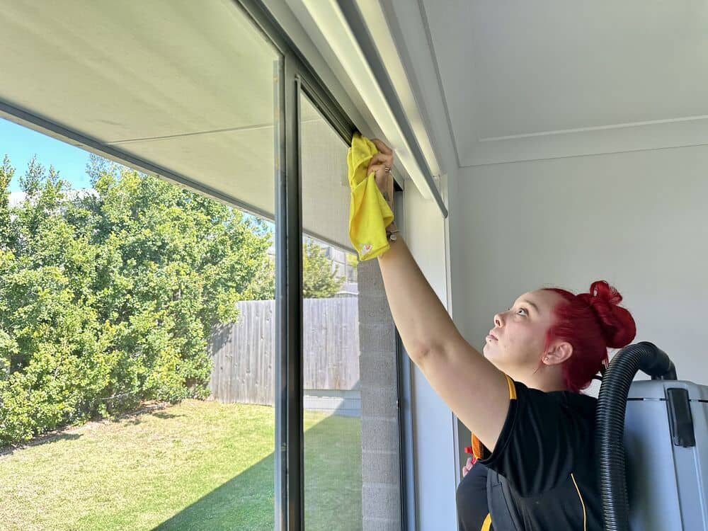 window and window tracks cleaning by a professional cleaner