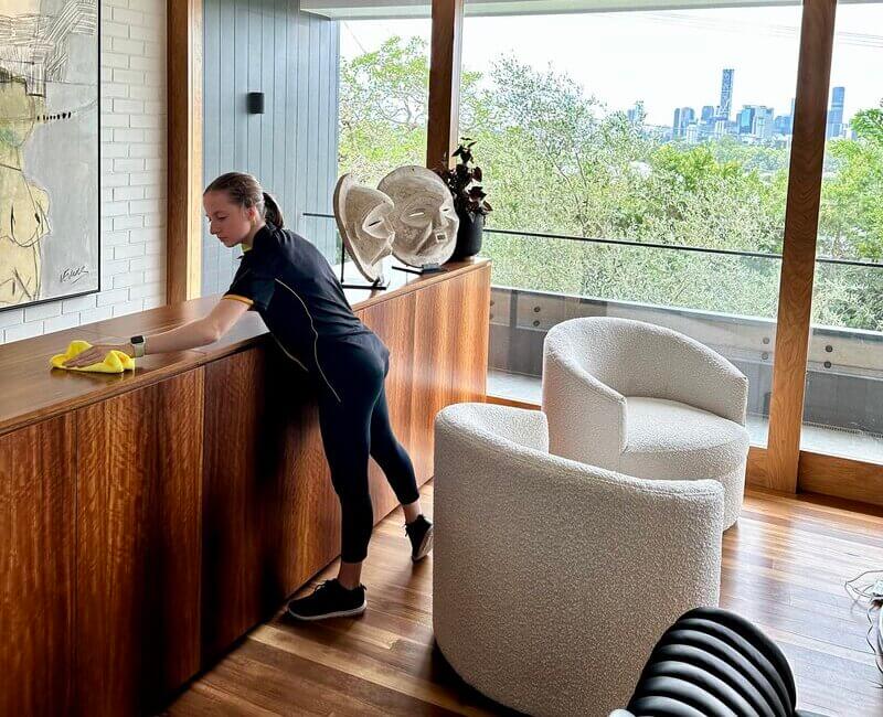 Maid2Match-domestic-cleaner-cleaning-in-the-living-room Maid2Match Brisbane professional cleaner Jade cleaning in the living room
