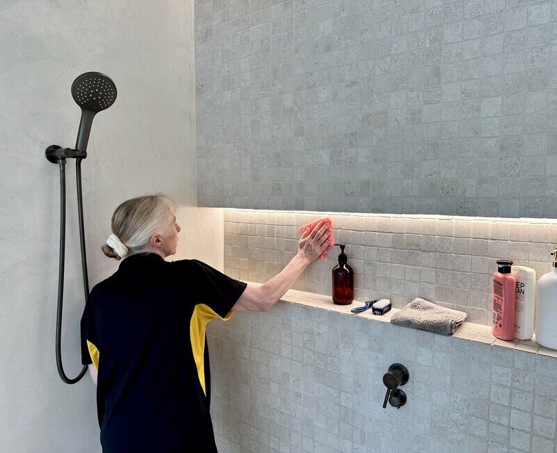 Maid2Match-house-cleaner-cleaning-bathroom-surfaces Maid2Match Gold Coast professional cleaner Lisa cleaning shower surfaces