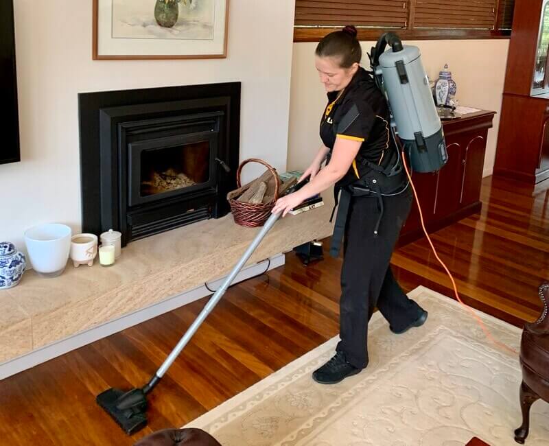 Maid2Match-professional-house-cleaner-Nikita-vacuuming Brisbane professional cleaner Nikita vacuuming the living room
