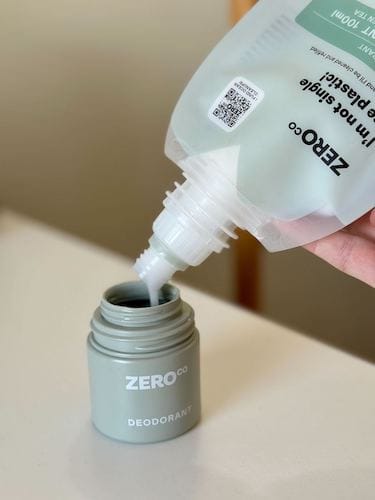 Pouring deodorant into forever bottle Zero Co