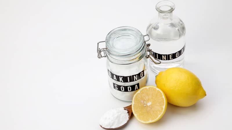 baking soda vinegar and lemon on the white background