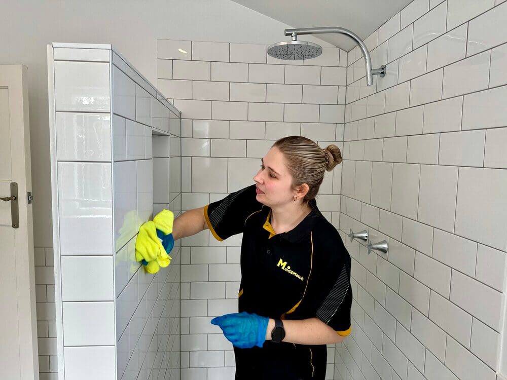 Kate-lyn-cleaning-tile-grout Maid2Match house cleaner Kate-lyn cleaning tile grout with microfibre cloth