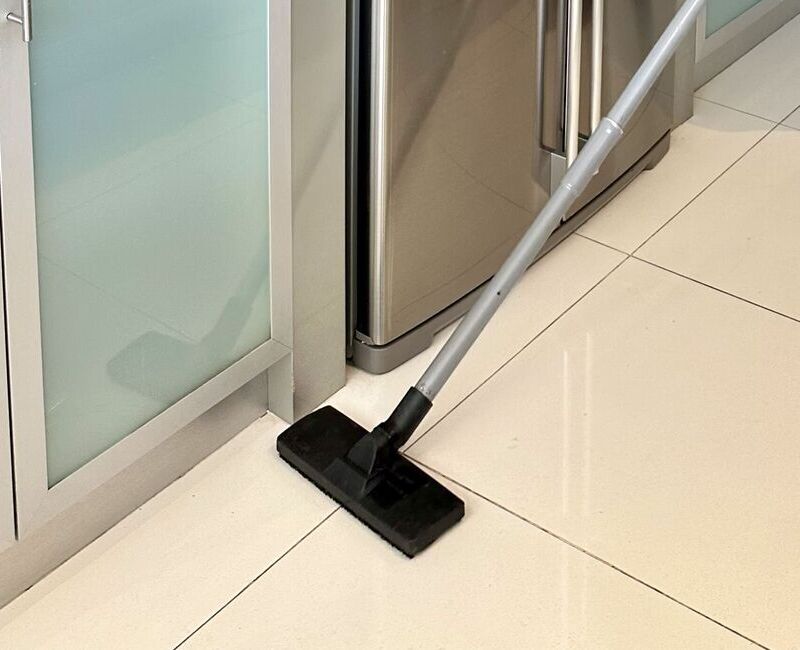 using-vacuum-to-clean-tiled-floor using a vacuum to clean the floor before cleaning the tile grout