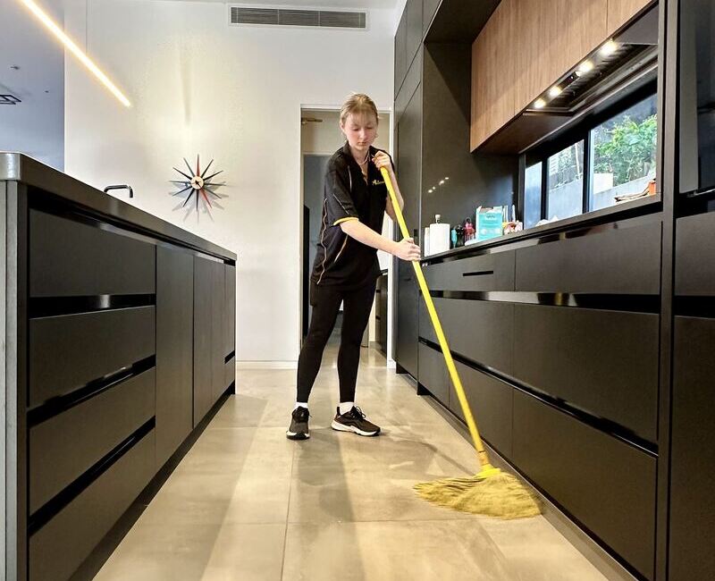 Casey mopping tile floors