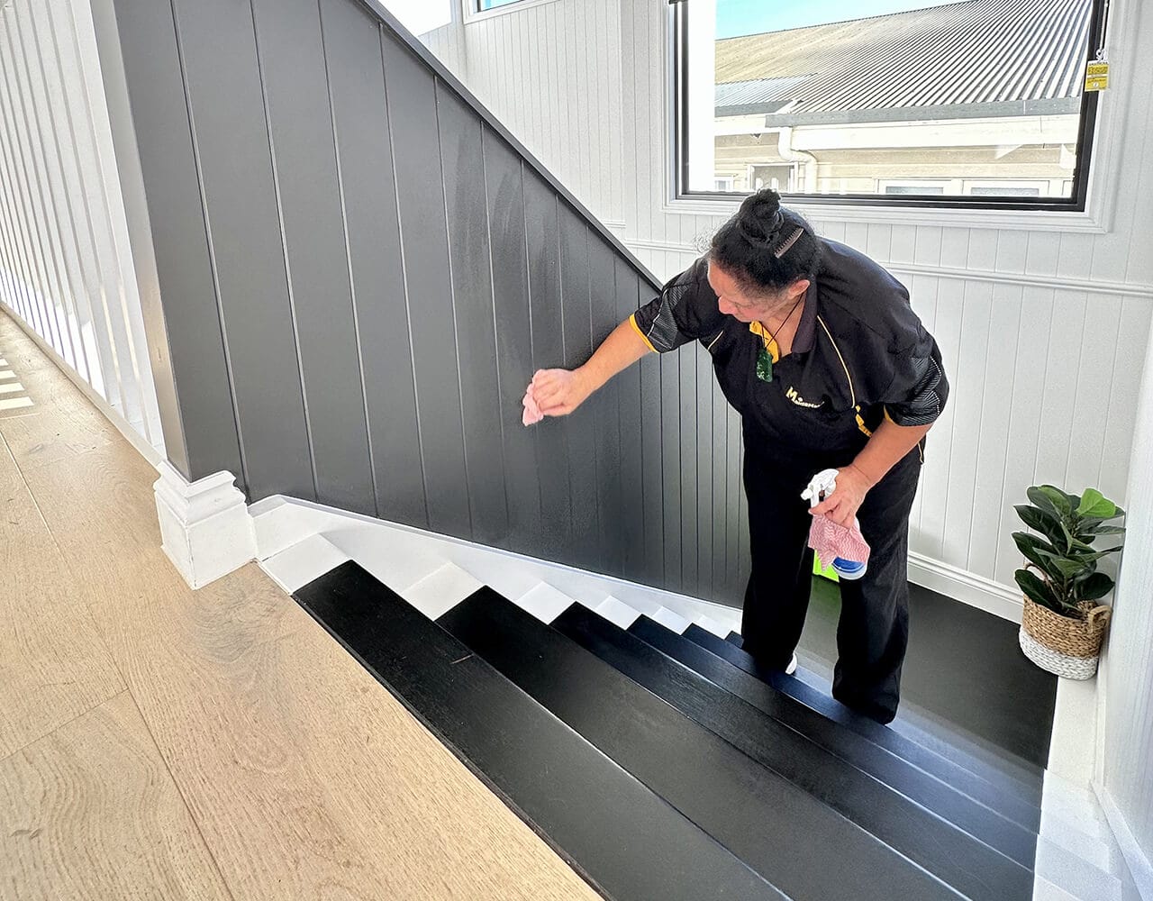Janet cleaning the staircase