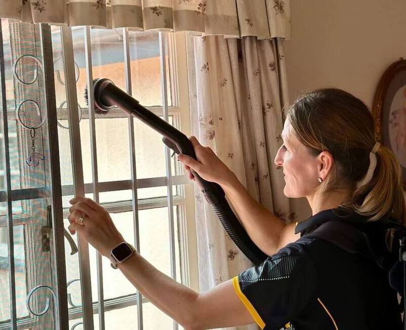 Maid2Match-cleaner-Lia-cleaning-fly-screen Maid2Match cleaner Lia cleaning window with fly screen using vacuum