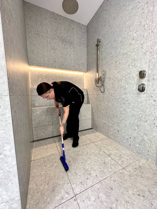 Kirsten cleaning shower floor