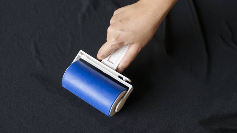 Lint roller on black cloth