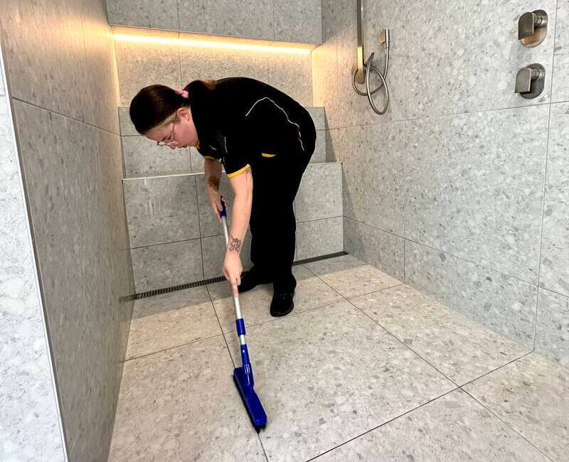 Professional-cleaner-Kirsten-scrubbing-shower-floor-grout Professional house cleaner Kirsten scrubbing shower floor