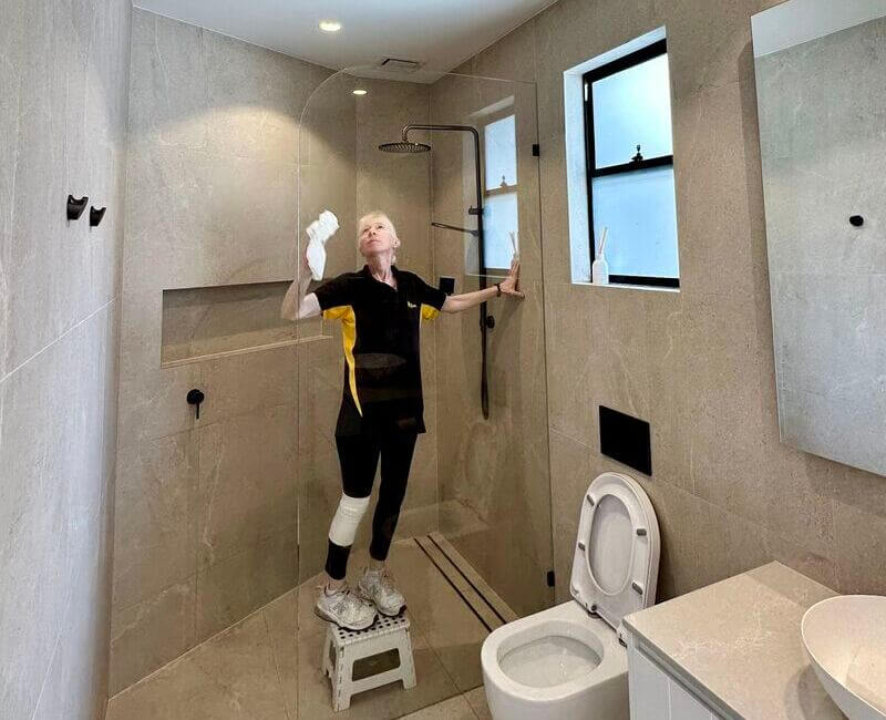 Maid2Match-Gold-Coast-cleaner-Lisa-cleaning-shower-glass Maid2Match Gold Coast house cleaner Lisa B cleaning shower glass