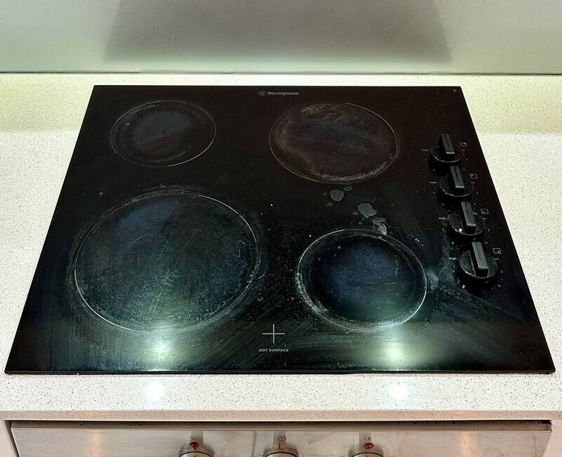 electric stove top with visible stains