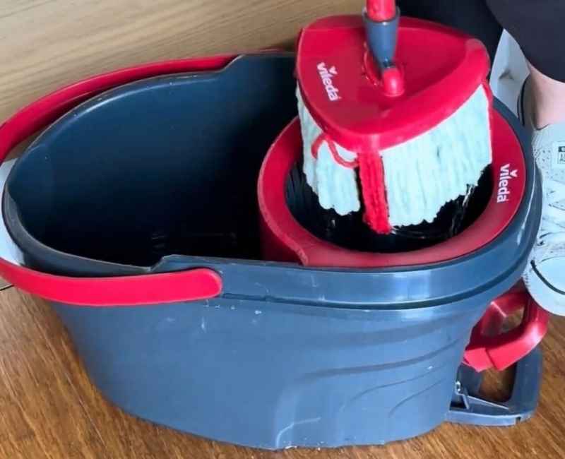 red spin mop with water bucket