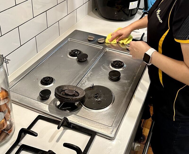 Maid2Match professional cleaner polishing stainless steel cooktop