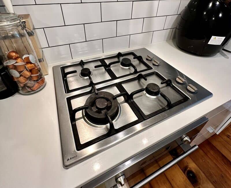 Stovetop cooker with grates in the kitchen