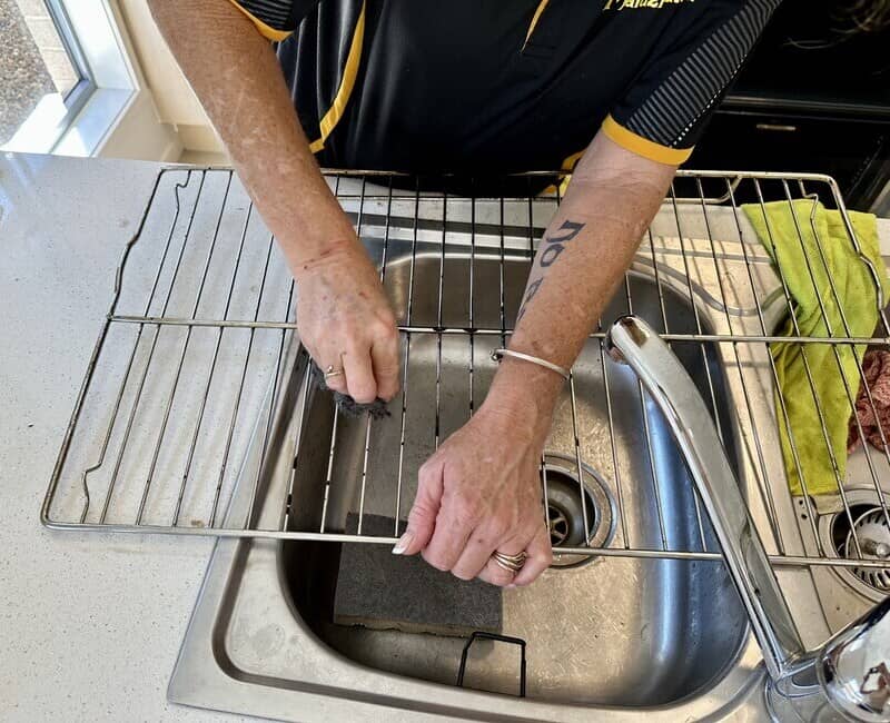 Maid2Match professional house cleaner cleaning oven rack