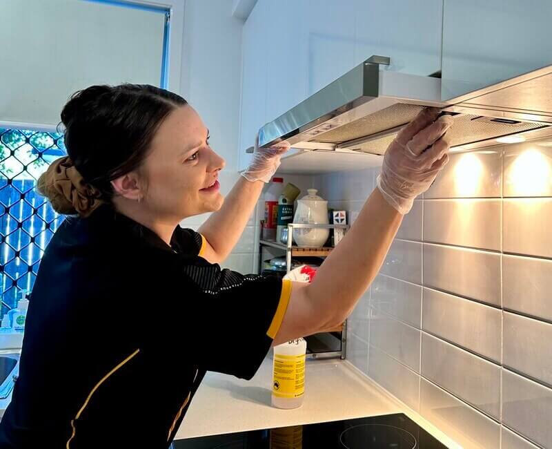 Brisbane professional cleaner Alison removing rangehood filter