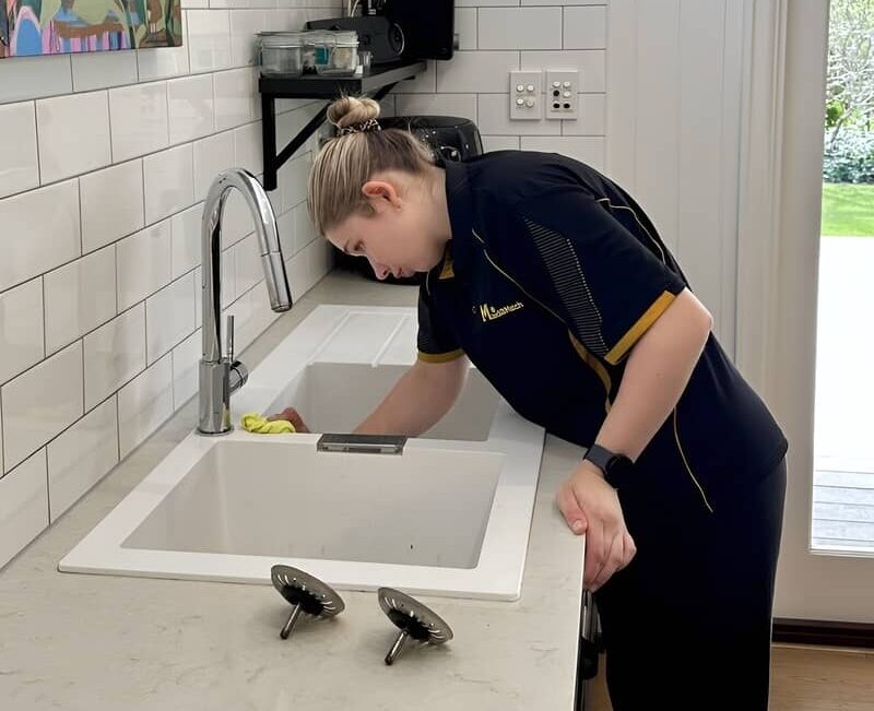Maid2Match-cleaner-cleaning-granite-sink Maid2Match fully trained and vetted cleaner Kate-lyn cleaning a granite kitchen sink