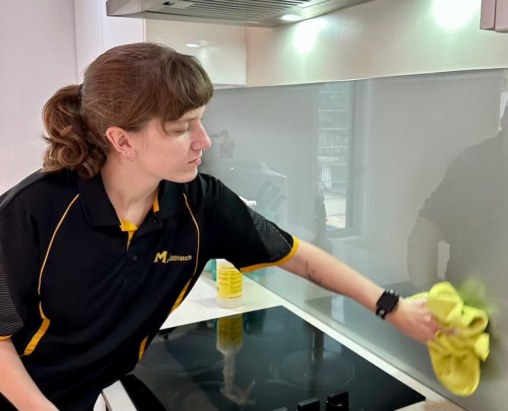 kayleigh-wiping-backsplash Kayleigh wiping kitchen backsplash