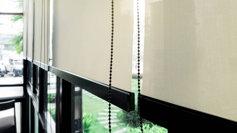 cream colored roller blinds up close