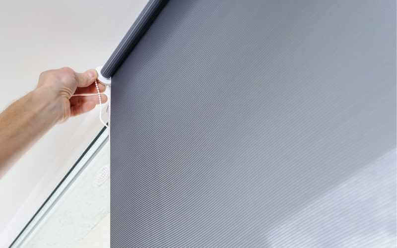 hand. installing new roller blinds