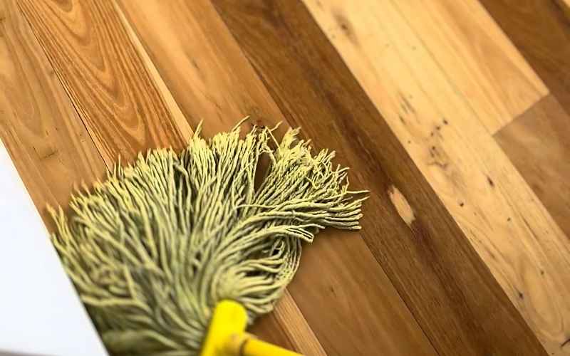 yellow mop on wooden floor
