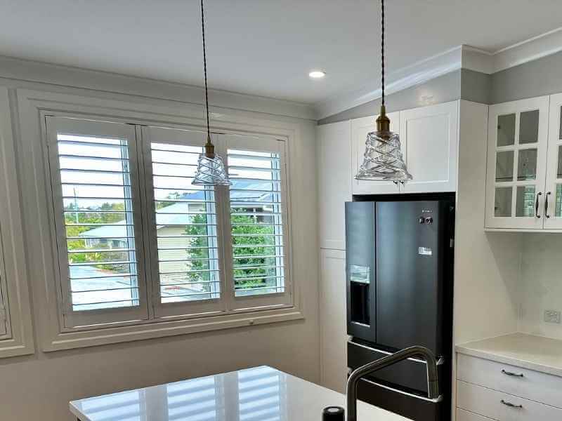 plantation shutters in the kitchen window