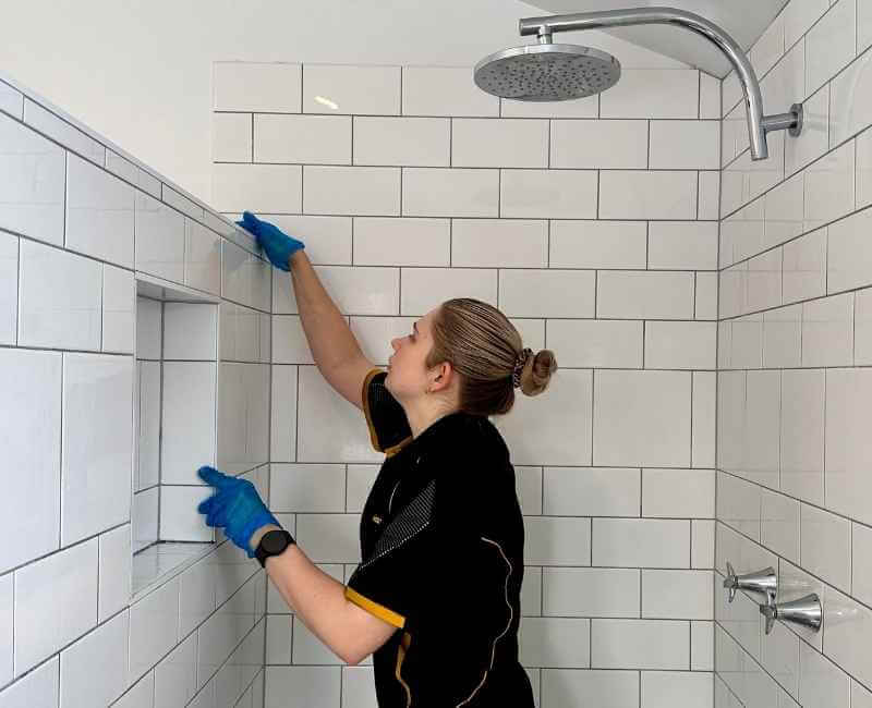 Brisbane professional cleaner cleaning bathroom shower wall