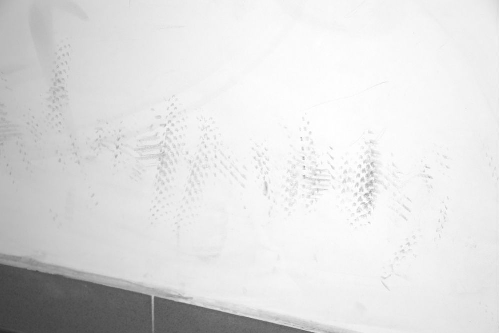scuff marks on white wall