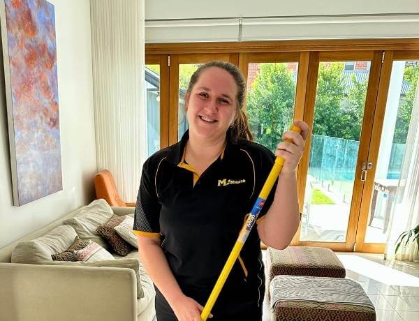 Brooke-holding-a-mop Maid2Match Adelaide Professional Cleaner, Brooke, holds a mop for house cleaning