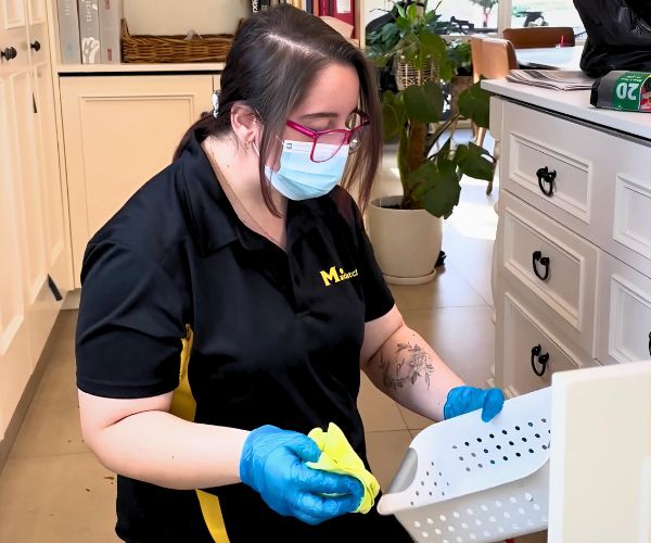 Susie-Adelaide-cabinet-cleaning Maid2Match Adelaide Professional Cleaner, Susie cleans a plastic basket