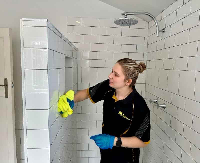 Maid2Match professional cleaner Kate-Lyn, Brisbane - preparing shower area for house cleaning