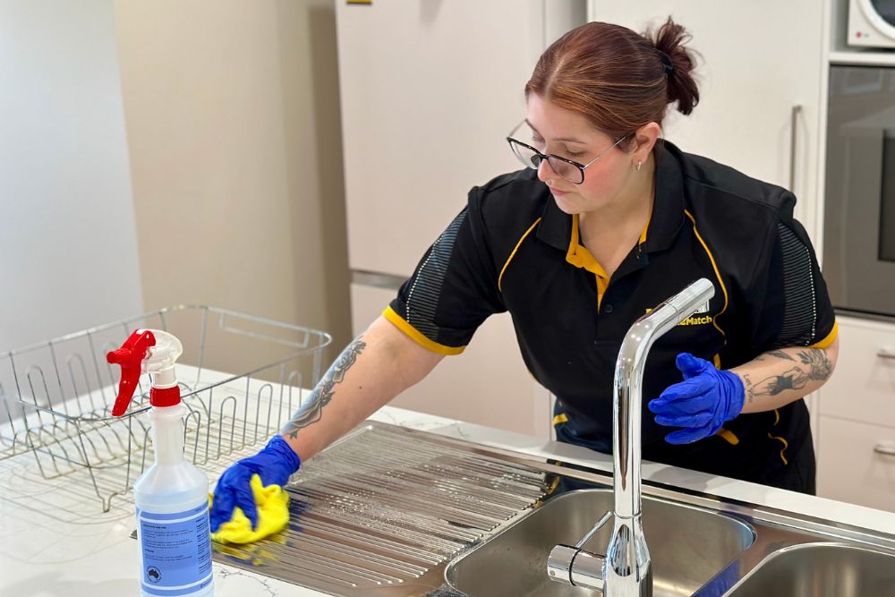 Maid2Match Geelong professional house cleaner Paris cleaning the kitchen sink