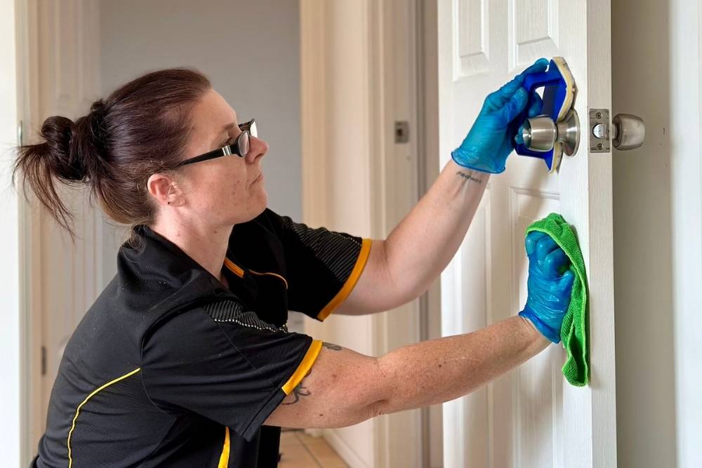 Maid2Match professional house cleaner and bond cleaner Renee cleaning door and door knob