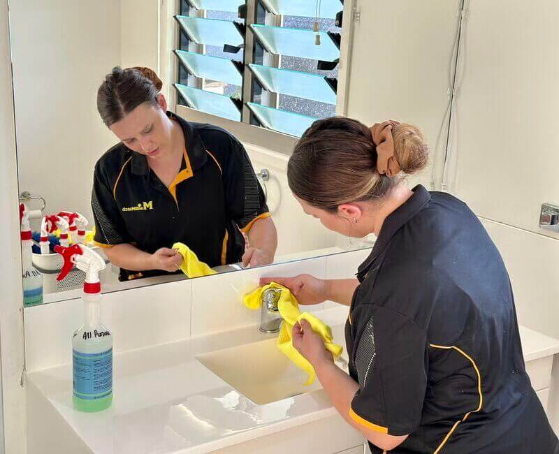 NDIS-cleaner-Alison-cleaning-bathroom-sink-faucet NDIS professional cleaner Alison cleaning bathroom sink faucet