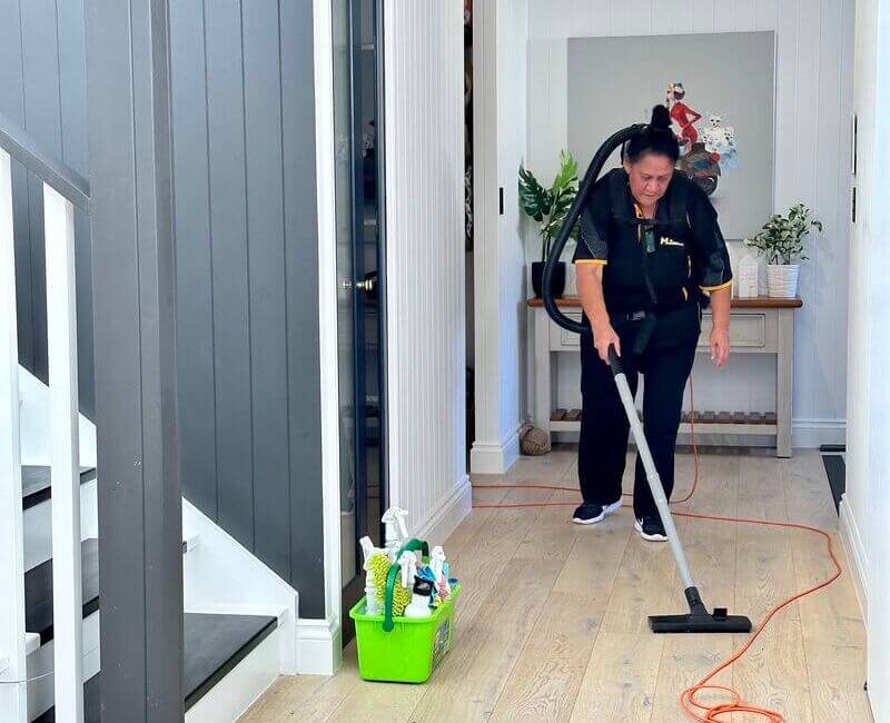 Maid2Match-NDIS-cleaner-Janet-vacuuming-floor Maid2Match NDIS professional cleaner Janet vacuuming the floor