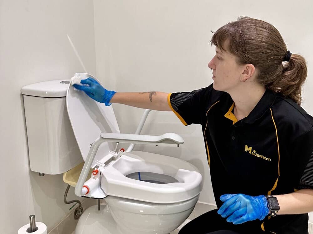 NDIS-Cleaner-Kayleigh-cleaning-a-toilet Kayleigh cleaning the toilet