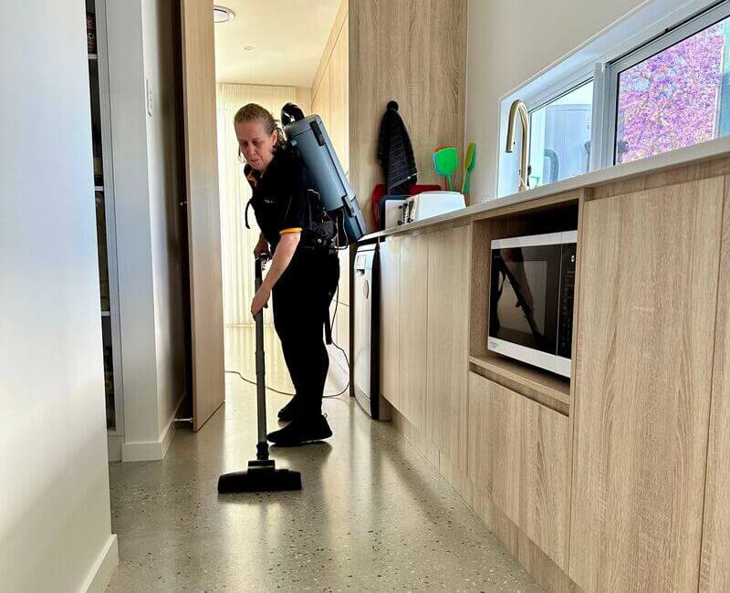 Maid2Match-NDIS-cleaner-Nicole-vacuums-floor Maid2Match NDIS cleaner Nicole vacuuming the floor