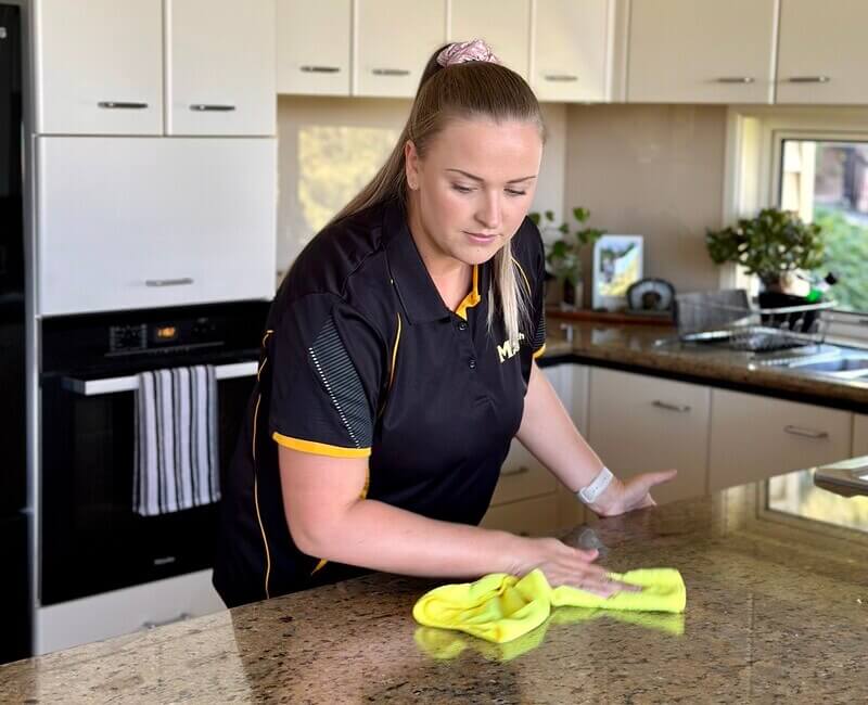 division-manager-stevie-cleaning-benchtop Maid2Match Division Manager Stevie cleaning a benchtop