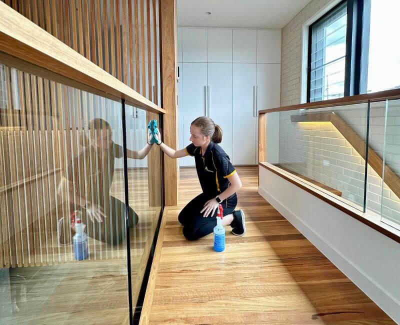 Maid2Match-Brisbane-house-cleaner-cleaning-glass-railings Brisbane professional house cleaner Jade cleaning glass railings
