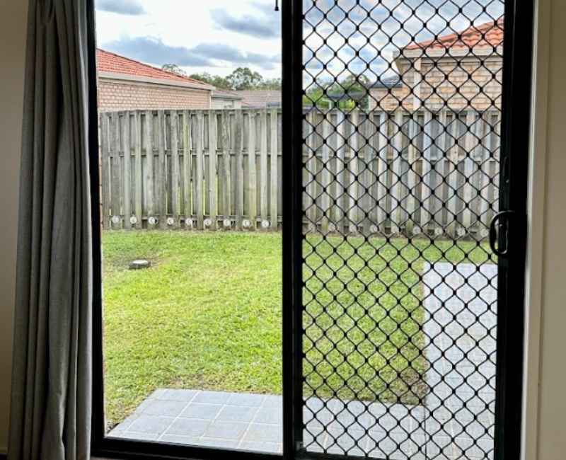 Security screen installed with sliding glass doors